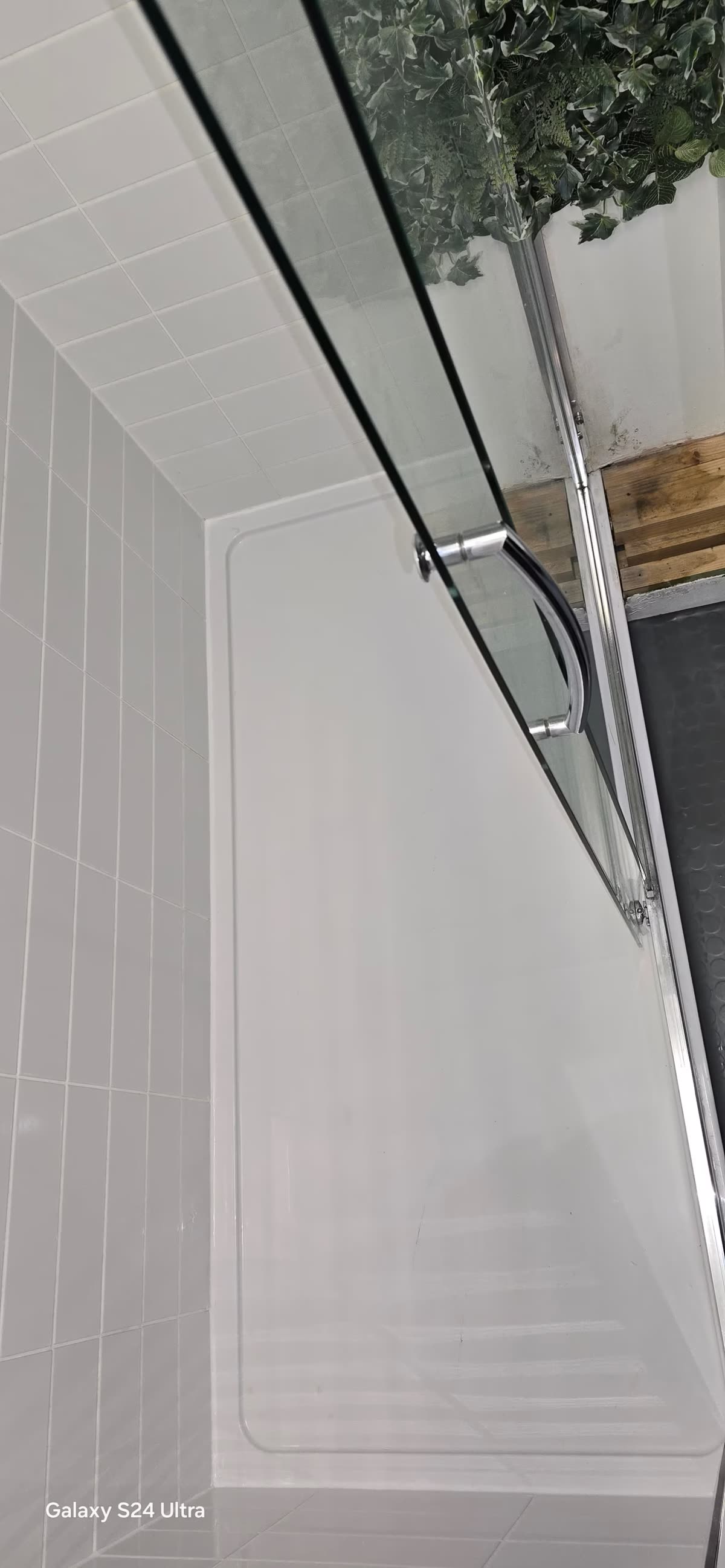 Large format tiled bathroom floor with new low-profile shower tray