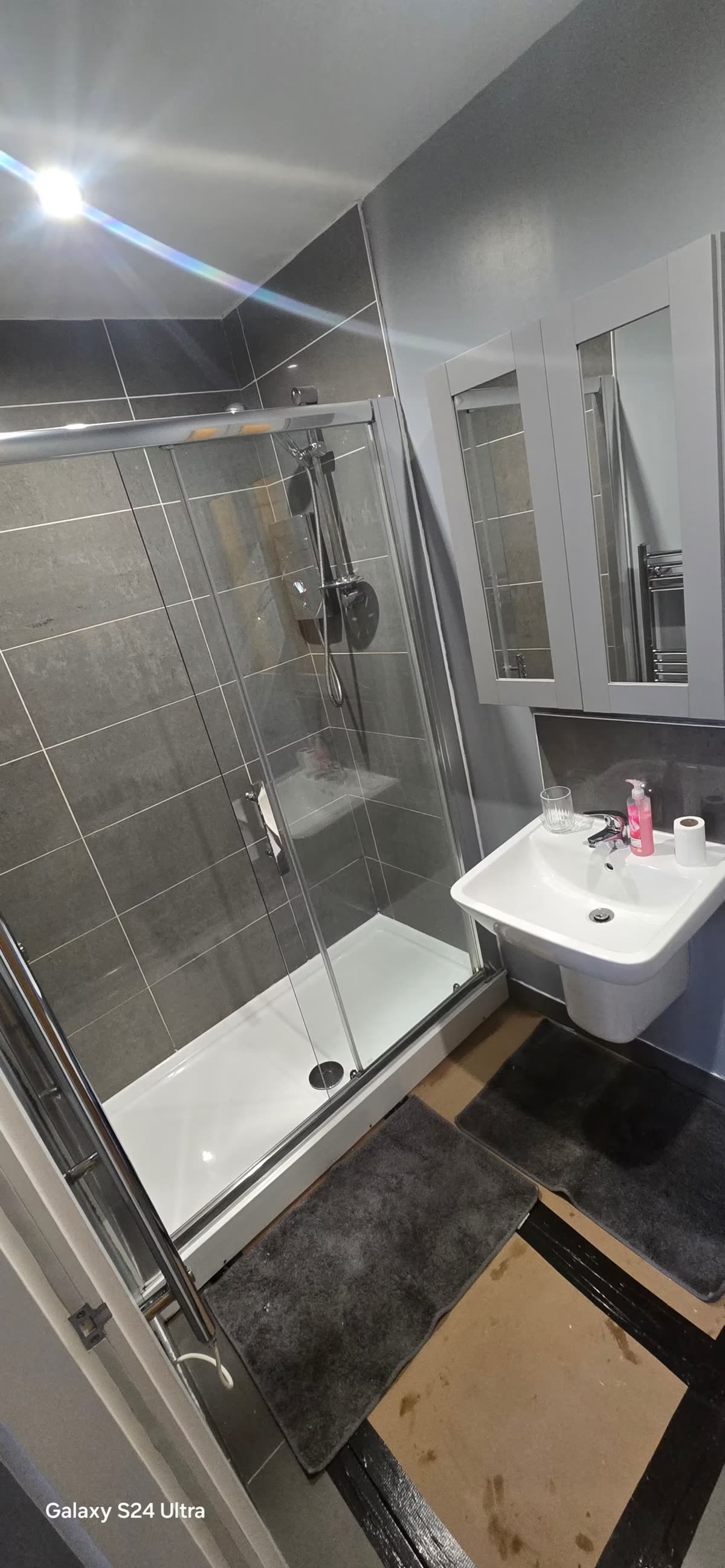 Newly fitted shower enclosure and vanity unit in a Sheffield bathroom